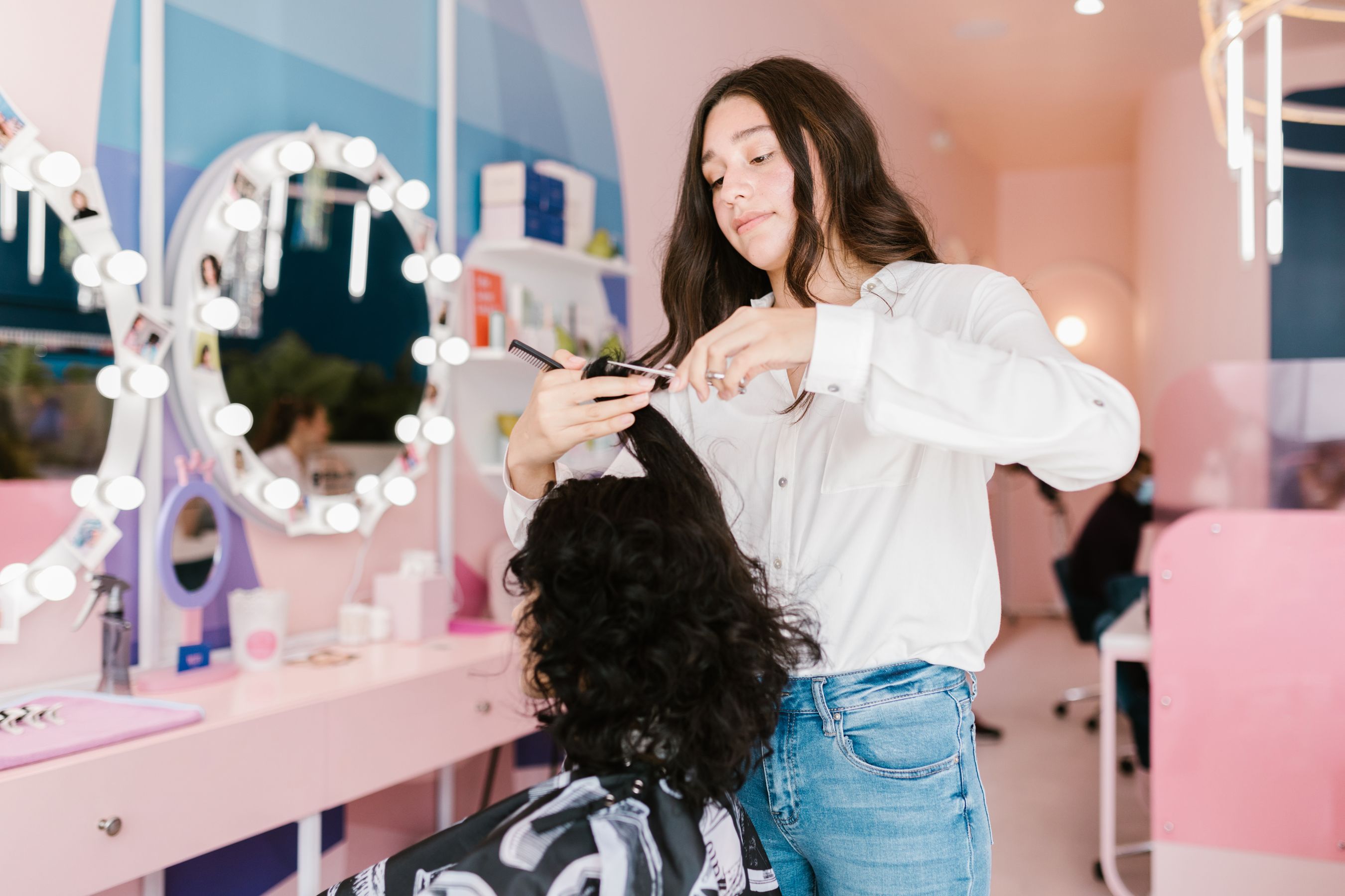 Stylist finishing a client’s hair at GSP Beauty Parlour in Noida