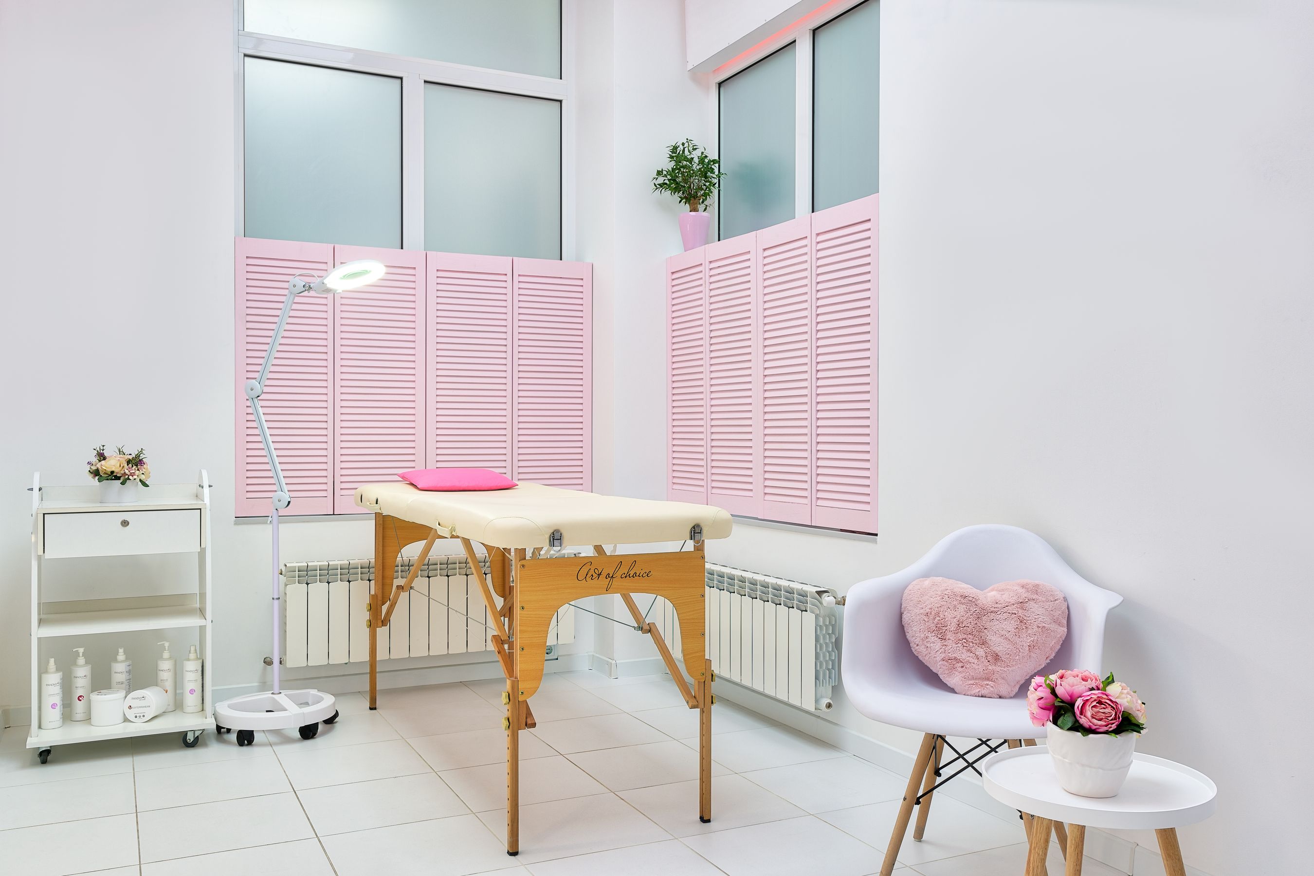 Clean, calm treatment room with a massage table